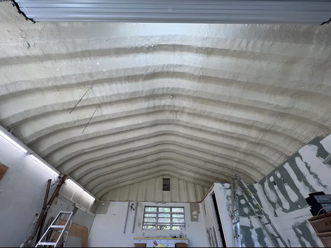 Spray polyurethane foam applied to the underside of a metal roof deck in Thousand Oaks